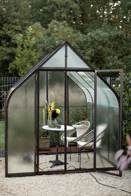 Vintage greenhouse in backyard