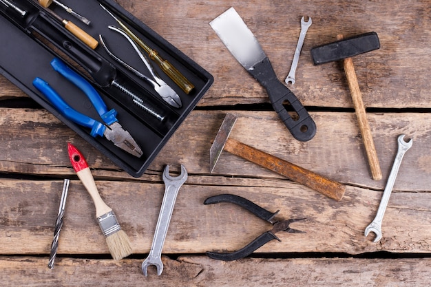 Vintage hand tools on rustic background