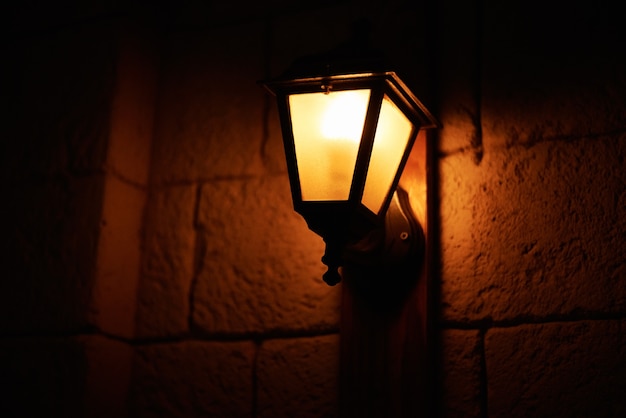 Vintage lantern at night. Old lantern in the city street