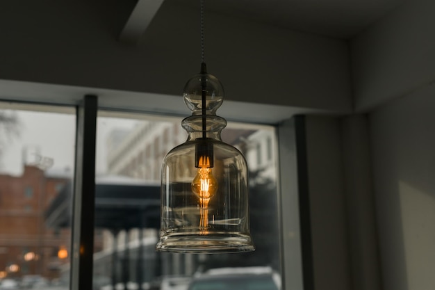 Vintage light bulb hanging from ceiling for decoration in loft coffee shop