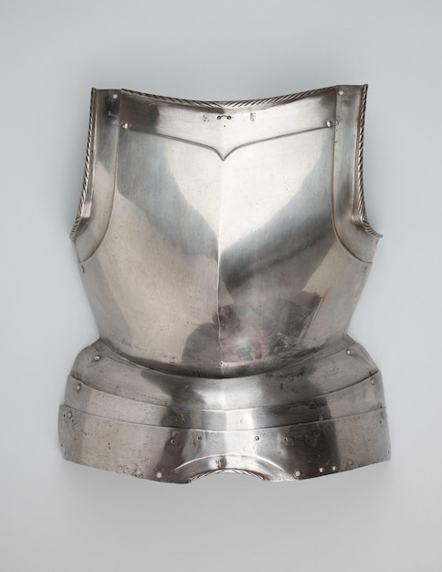 Vintage metal warrior breastplate isolated on a gray background