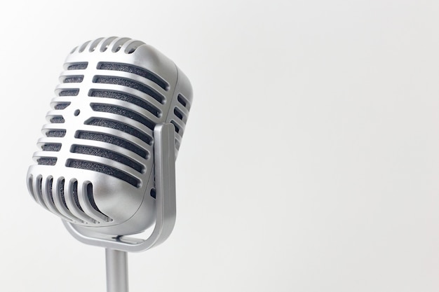 The vintage microphone close up image on white background.