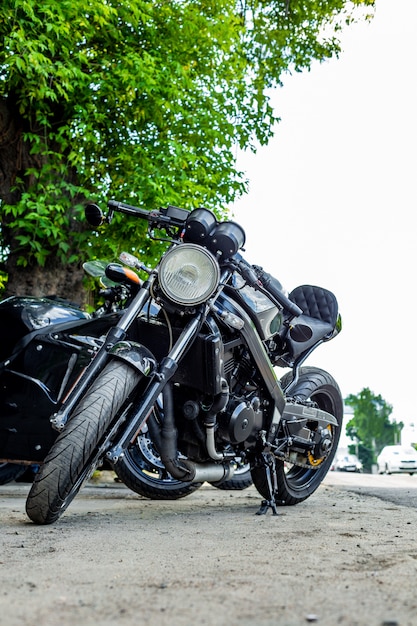 Vintage motorcycle parking on the road. Side view, close up