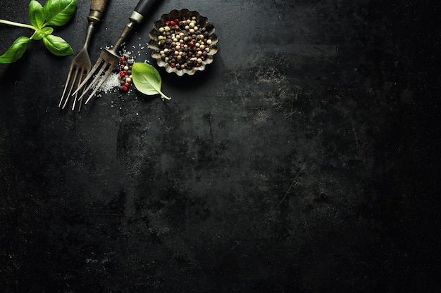 Vintage old rustic cutlery on dark background