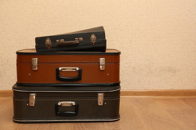 Vintage old travel suitcases on floor