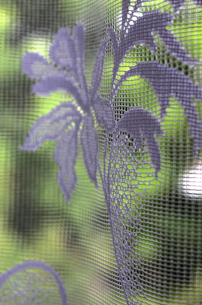 Vintage old tulle on the window on a sunny day Selective focus