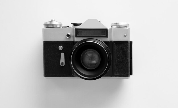 Vintage photo camera on white table