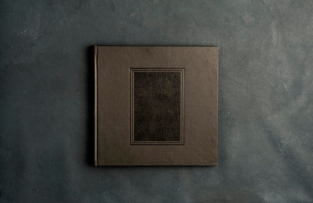 Vintage photographic album closed on gray background