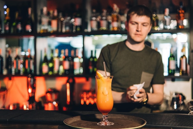 Vintage portrait of bartender creating cocktails at bar Close up of alcoholic beverage preparation