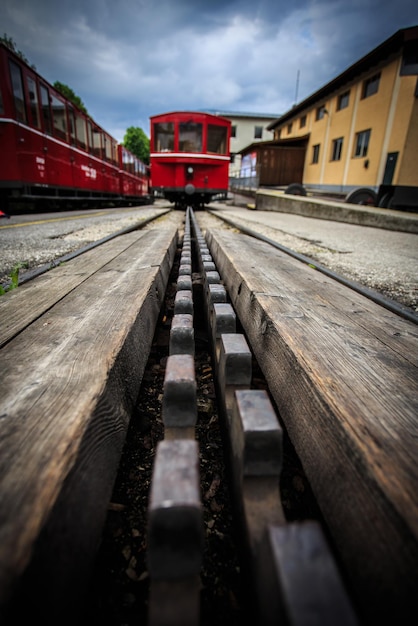 Vintage red trains parked on tracksAustria