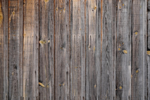 Vintage retro brown wood veritcal background in old weathered wooden plank