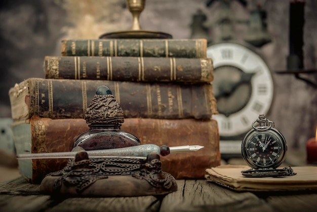 Vintage study table view with books and golden clock in front