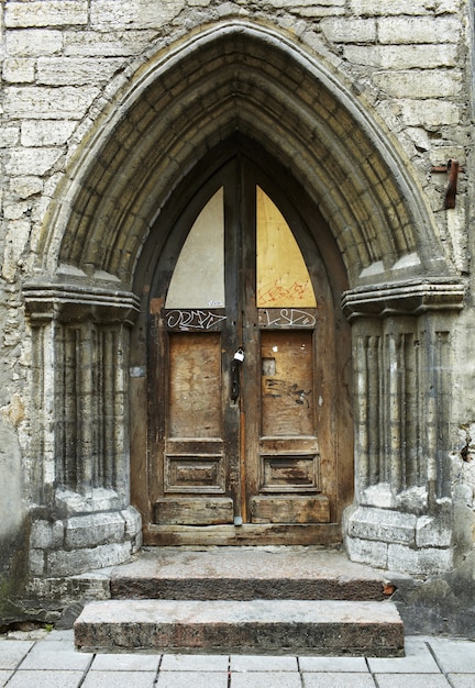 Vintage style arch and door with stained-glass window in Tallinn, Estonia