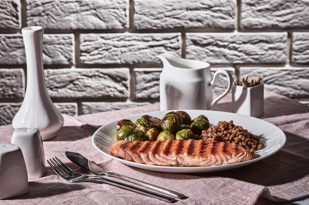 Vintage style of table set with grilled salmon