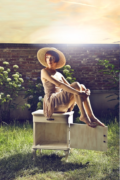 Vintage style woman in a garden