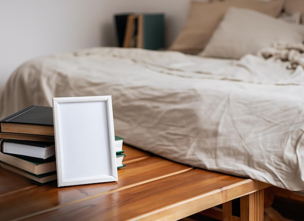 vintage table beside bed with photo frame and books