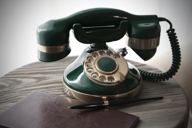 Vintage telephone on wooden table