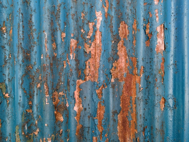 Vintage texture on metal surface with traces of old paint and rust