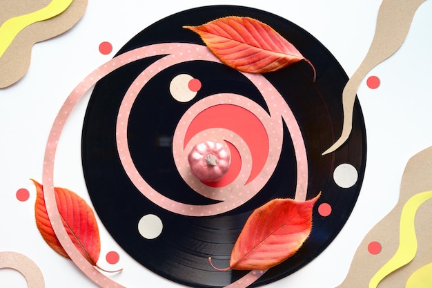 Vintage vinyl record Abstract paper art geometric Autumn background Fibonacci circle shapes natural red orange Fall leaves red circles Flat lay top view romantic music sound background