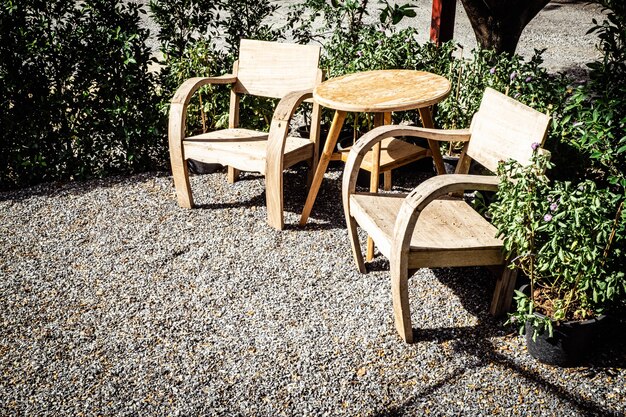 Vintage wooden Chairs on backyard tropical garden