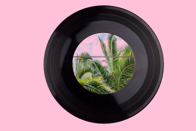 Vinyl record with palm trees. a variant design of a vinyl record. mixed media.