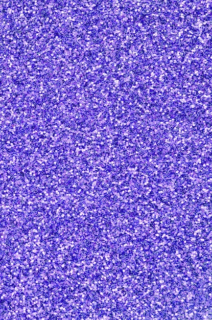 Violet decorative sequins. image with shiny bokeh lights from small elements