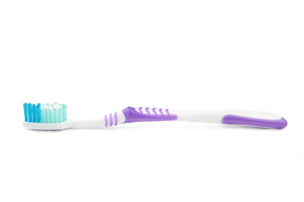 Violet toothbrush isolated on a white