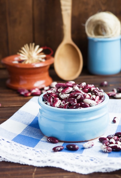 Violet with dots beans in ceramic bowl.