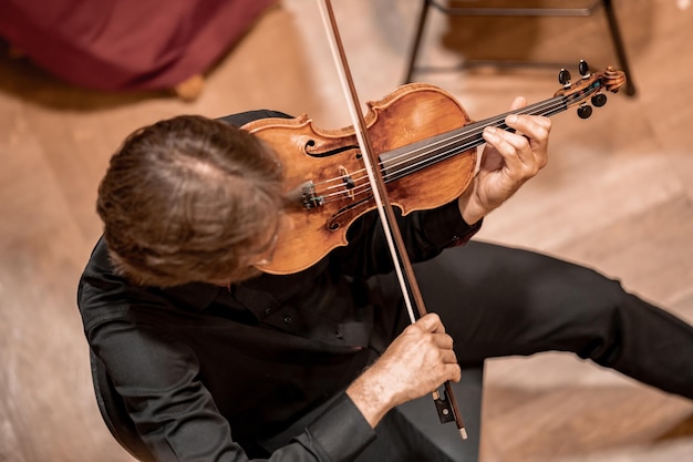 A violinist plays at a concert in the Philharmonic