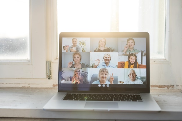 Virtual meeting online. Video conference by laptop. Online business meeting. On the laptop screen, people who gathered in a video conference to work on-line