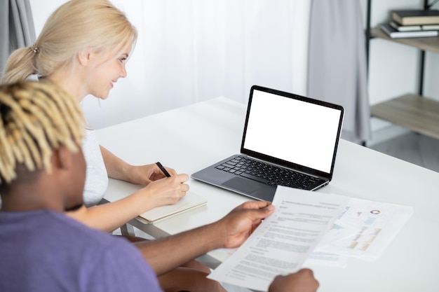 Virtual meeting working couple digital mockup smiling woman making notes while black man checking