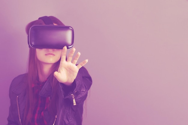 Virtual reality and the digital world of gadgets and video games Woman in VR helmetConcept of the future