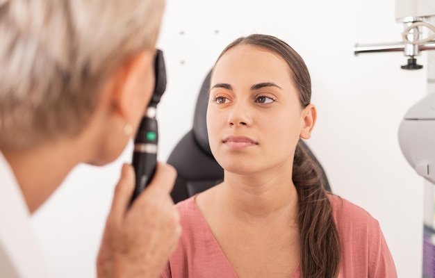 Vision eye exam patient or woman with optometrist for glaucoma test ocular healthcare support or medical consultation Eye care eyesight or ophthalmology expert with ophthalmoscope to check retina