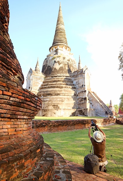 Visitor Taking Photos of the Famous Historic Pagoda of Wat Phra Si Sanphet in Ayutthaya Historical Park, Thailand