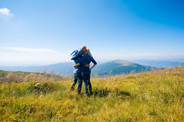 Vista mountain landscape and family hiking trip