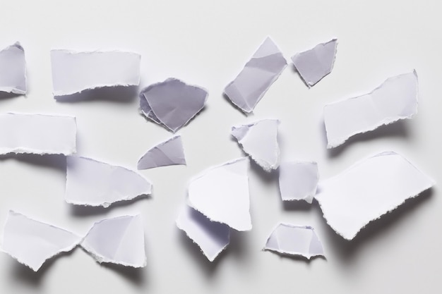 Photo visual and conceptual analysis the aesthetics of torn paper against a white background