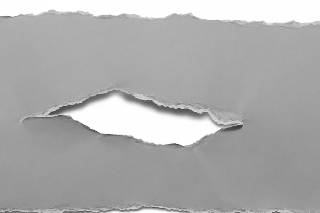 Visual and Conceptual Analysis The Aesthetics of Torn Paper Against a White Background