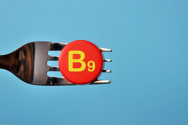 Vitamin B9 on the fork, food with a high content of vitamin B