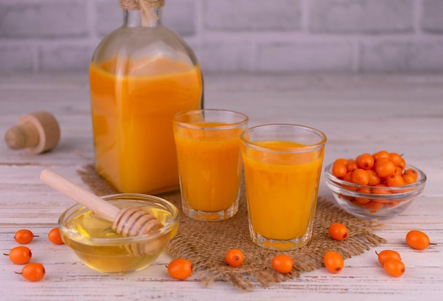 Vitamin juice from sea buckthorn with honey.