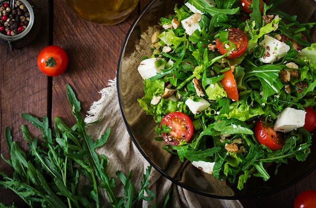 Vitamin Salad of fresh tomatoes, herbs, feta cheese and flax seeds. Dietary menu. 