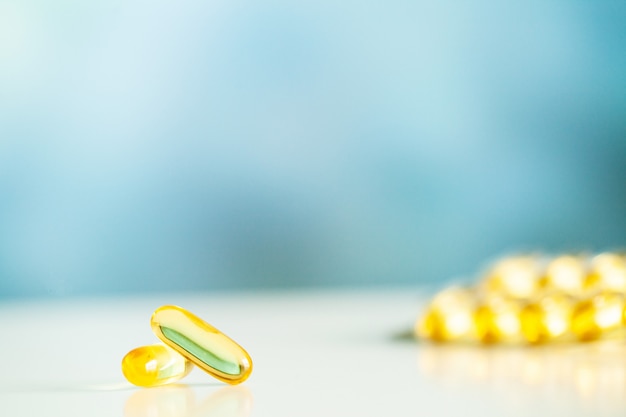 Vitamins supplements, fish oil in yellow capsules omega 3