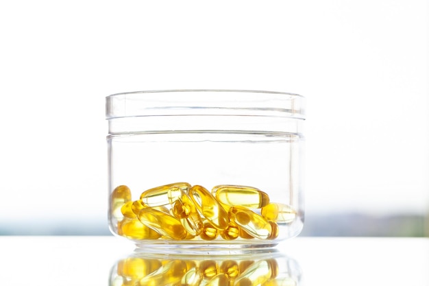 Vitamins supplements fish oil in yellow capsules omega 3