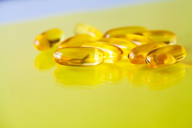 Vitamins supplements, fish oil in yellow capsules omega 3.