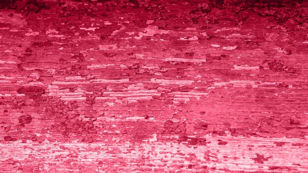 Viva Magenta toned red magenta rustic texture of damage wall door. Vintage abstract field