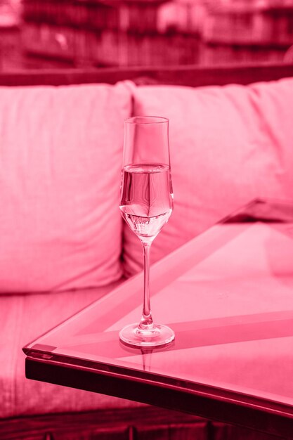 Viva Meganta toned red magenta crystal glass with chilled champagne table in the restaurant