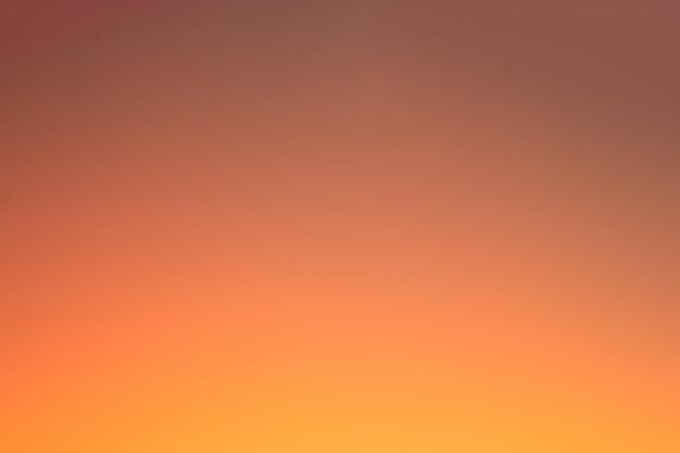 Vivid blurred colorful orange and yellow wallpaper background