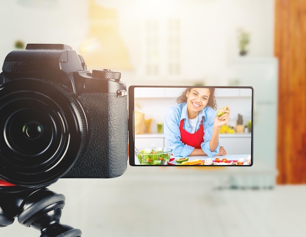 Vlogger woman chef records a video of cooking recipe