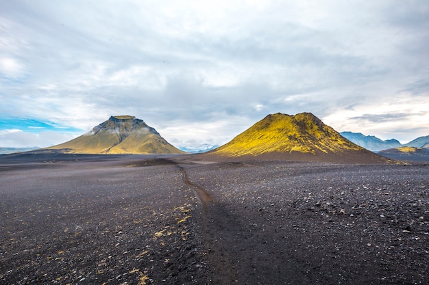 Volcanic ash and two green mountains. Landmannalaugar, Iceland