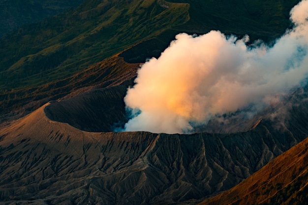 Volcano eruption with the sun shining down on the mountain in morning, Bromo volcano,Java,