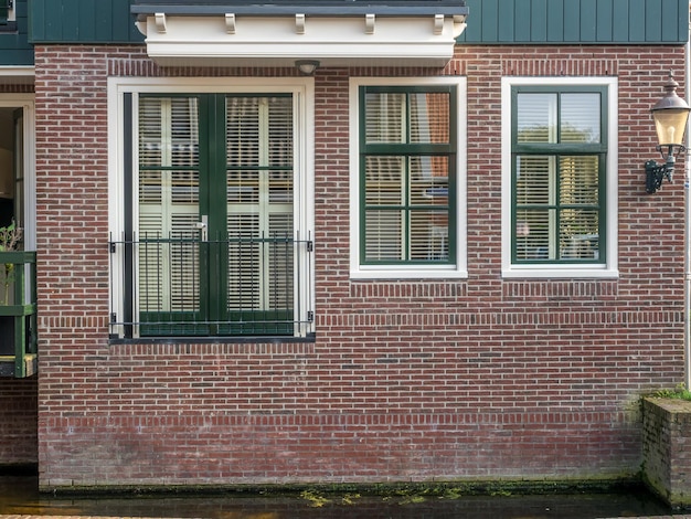 VOLENDAM - OCTOBER 4: City scene, residential buildings in Volendam, small cute town of Netherlands, was taken on October 4, 2015.